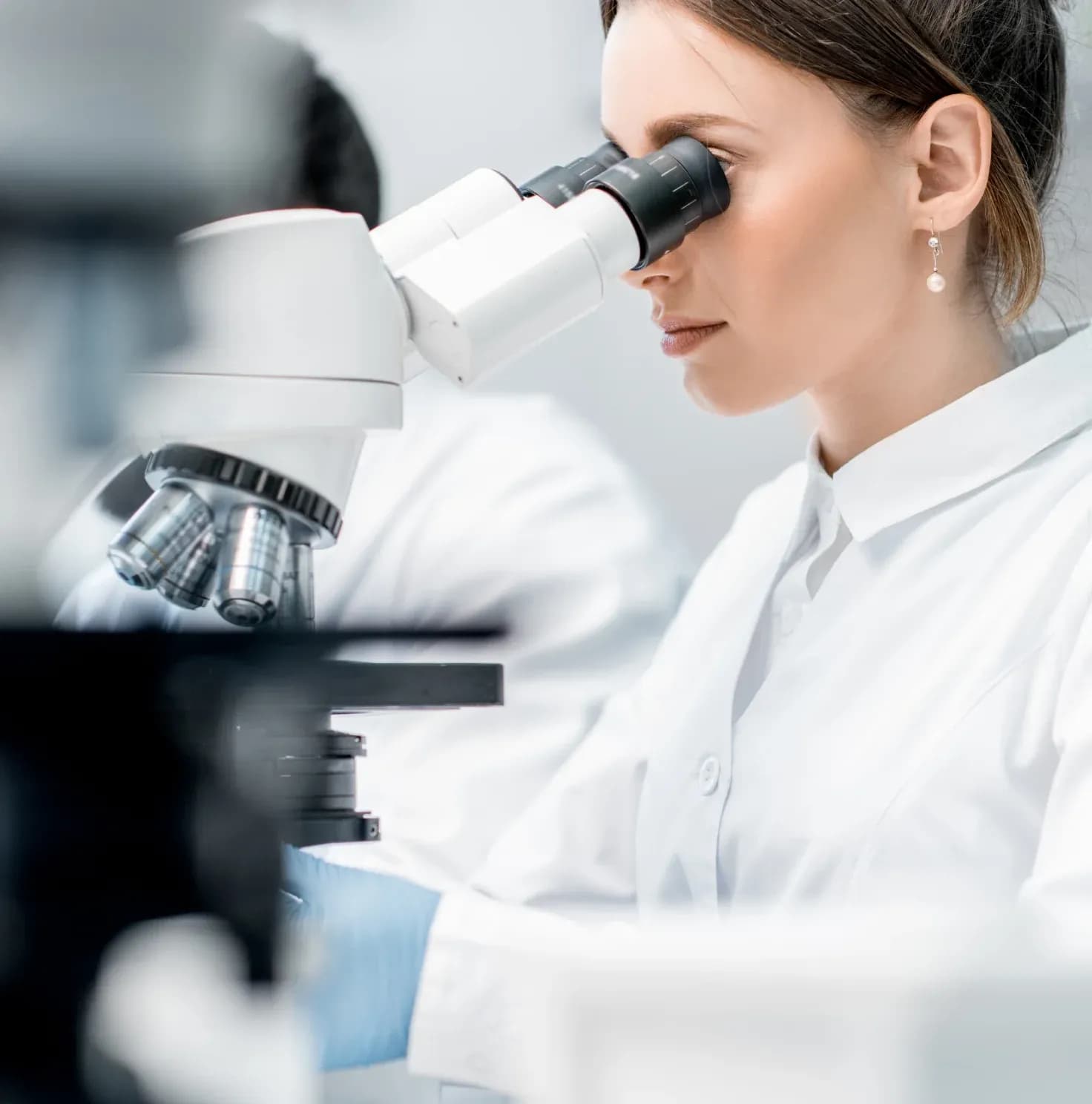 Lab Control employee using laboratory equipment